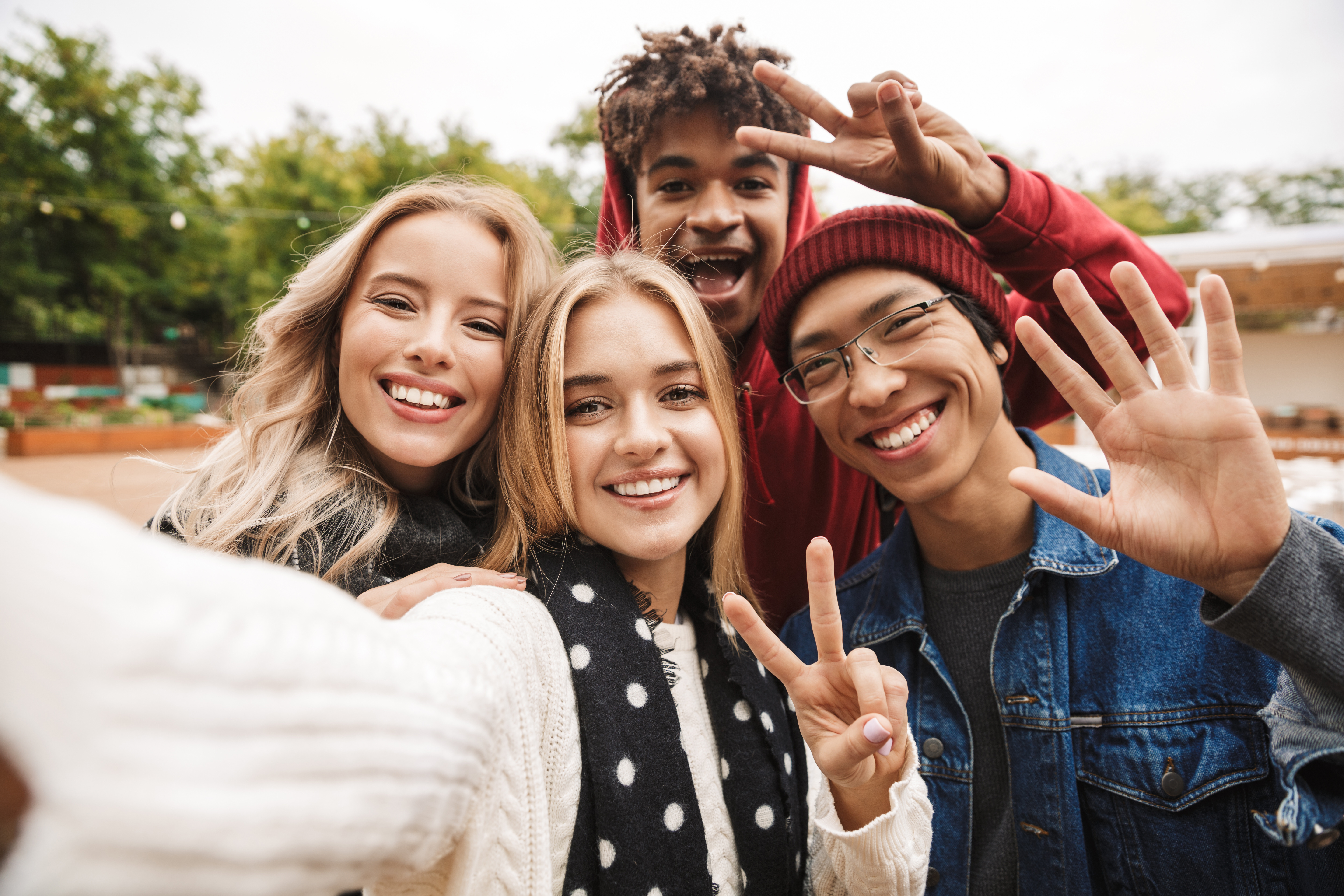 Group of teenagers happy with Magnifi accounts.