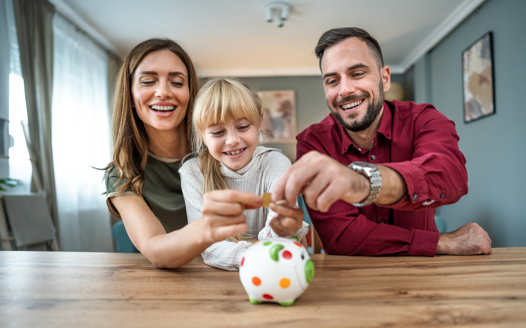 Family with child saving with Magnifi Financial Credit Union.
