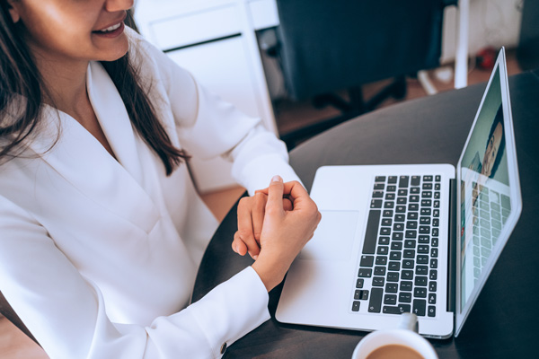 Businesswoman attending a webinar.