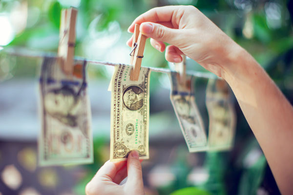 Hanging currency to dry after being cleaned.