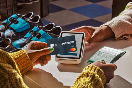 Using a Greenlight debit card at a bowling alley.