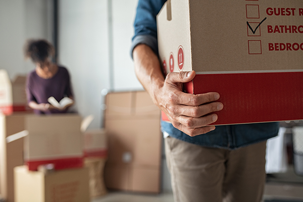 Packing boxes to move into new home.