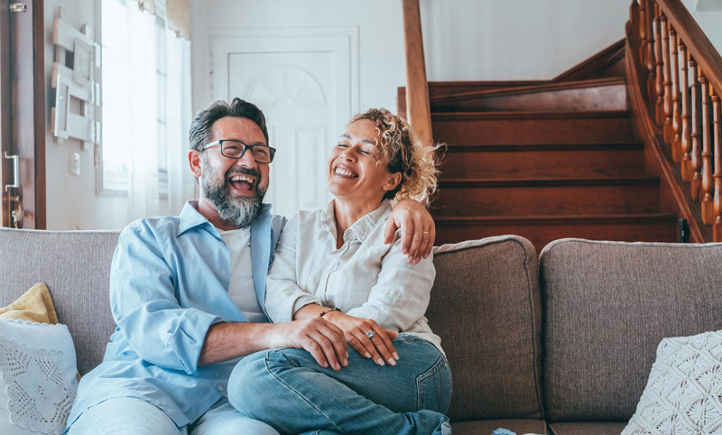 Happy couple in their home.