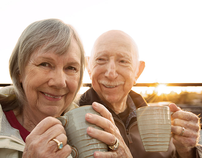 Elderly couple enjoying coffee together